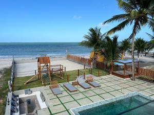 a view of the beach from the balcony of a house at Casa de praia Itamaracá - Pontal da Ilha in Itamaracá
