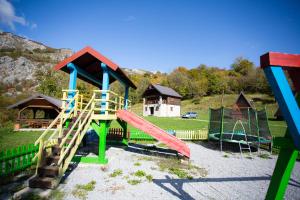 a park with a playground with a slide at BB CHALET in Kolašin