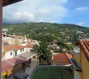 a view of a city from the roof of a building at Affittacamere A Feneira in San Biagio della Cima +6 photos