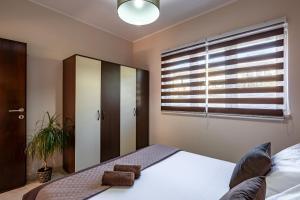 Posteľ alebo postele v izbe v ubytovaní D&A Apartments