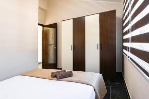 Posteľ alebo postele v izbe v ubytovaní D&A Apartments