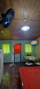 a room with a ping pong table and a ceiling at La casita del parque in Mar del Plata