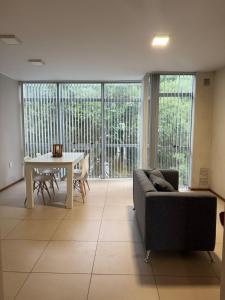 a living room with a couch and a table at Depto 2 dormitorios - LIBERTADOR in Vuelta del Paraguayo