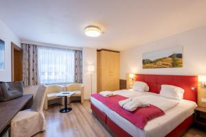 Postel nebo postele na pokoji v ubytování Genusshotel Almrausch