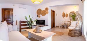 a living room with a couch and a table at Anastasia's House in Ouranoupoli
