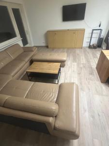 a living room with a couch and a table at Seeblick Bodensee 6, free Parking, free Internet, 24 h Checkin in Bregenz