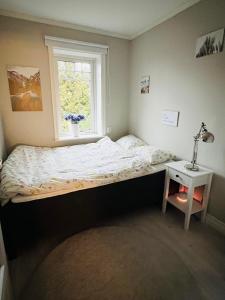 Rúm í herbergi á Traumhaus, Sauna, Whirlpool, grosse Terrasse mit Aussicht, Seeanstoss