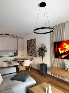 a living room with a couch and a table at Stylisches Design-Apartment in Rottenmann