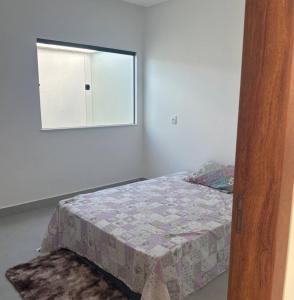 En eller flere senge i et værelse på Praia e conforto + 2 billeder