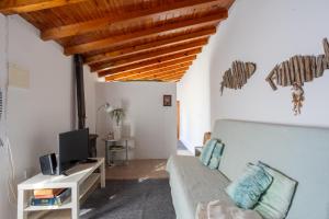 Una televisión o centro de entretenimiento en Casa da Luz