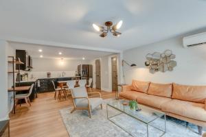 a living room with a couch and a table at Bright and Airy Historic Franklin Quadplex in Franklin