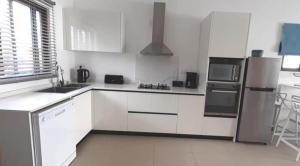 Cucina o angolo cottura di 3bed villa with private pool and rooftop with a sea view in flic-en-flac, Mauritius