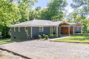 a small house with a gravel driveway at Bright Bungalow Country Dream Retreat in Franklin