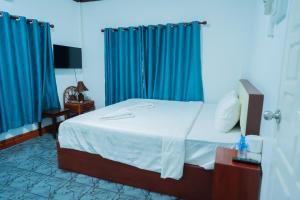 Postel nebo postele na pokoji v ubytování Vientiane Ruby Riverside Hotel