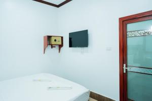 TV a/nebo společenská místnost v ubytování Vientiane Ruby Riverside Hotel
