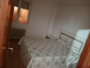 Ένα ή περισσότερα κρεβάτια σε δωμάτιο στο Piso 3 habitaciones Aranda de Duero céntrico