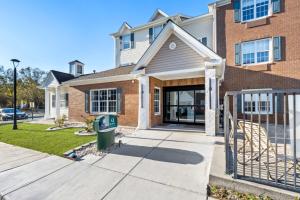 a house with a gate in front of it at MainStay Suites Columbia Harbison in Harbison