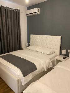Postel nebo postele na pokoji v ubytování Hotel Sidi