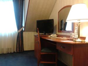 TV a/nebo společenská místnost v ubytování Hotel Basztowy