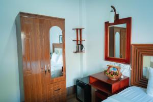 Postel nebo postele na pokoji v ubytování Vientiane Ruby Riverside Hotel