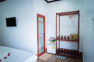TV a/nebo společenská místnost v ubytování Vientiane Ruby Riverside Hotel
