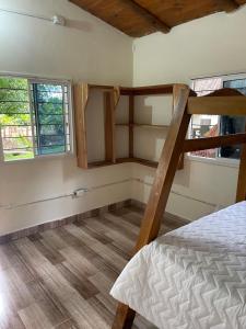 Postel nebo postele na pokoji v ubytování Hostal Ancestrales Capurgana