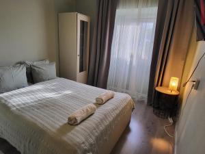 Posteľ alebo postele v izbe v ubytovaní Mi Casa Vendégház - Apartments