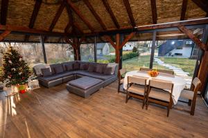 a living room with a couch and a table at Kuća za odmor Natur in Brežane Lekeničke +33 photos