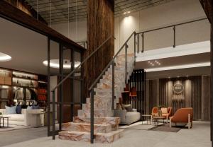 a lobby with a staircase and a living room at EHBoutique Experience in El Calafate