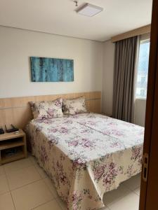 Ένα ή περισσότερα κρεβάτια σε δωμάτιο στο Apartamento Caldas Novas - Casa da Madeira +11 φωτογραφίες