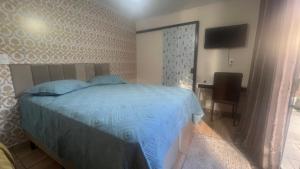 Postel nebo postele na pokoji v ubytování Quarto Aconchegante N 2