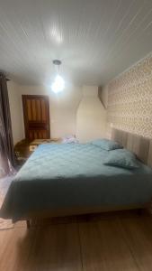 Postel nebo postele na pokoji v ubytování Quarto Aconchegante N 2