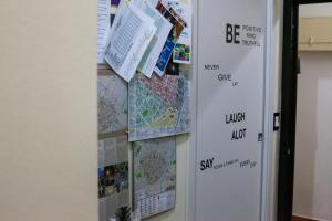 a wall with maps and papers on it at Affittacamere Nel Cuore di Faenza in Faenza