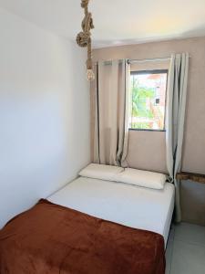 Ένα ή περισσότερα κρεβάτια σε δωμάτιο στο Casa Brisa Itacaré