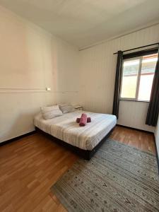 Cama ou camas em um quarto em VOY Hostales - Oriente