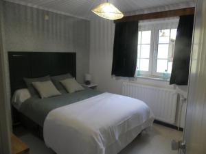 Postel nebo postele na pokoji v ubytování Gîte La Maison Jaune