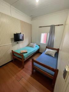 Cama ou camas em um quarto em VOY Hostales - Oriente