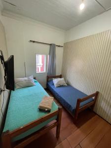 Cama ou camas em um quarto em VOY Hostales - Oriente