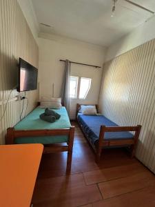 Cama ou camas em um quarto em VOY Hostales - Oriente
