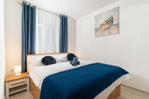 Posteľ alebo postele v izbe v ubytovaní Apartments Lux 3 + 35 fotografií