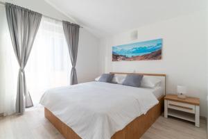 Posteľ alebo postele v izbe v ubytovaní Apartments Lux 3