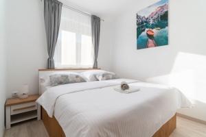 Posteľ alebo postele v izbe v ubytovaní Apartments Lux 3
