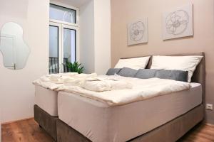 Postel nebo postele na pokoji v ubytování Apartment Comfort - with Aircondition!