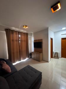 TV a/nebo společenská místnost v ubytování Apartamento Alto Padrão Caxambu