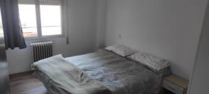 Ένα ή περισσότερα κρεβάτια σε δωμάτιο στο Cómo en casa Villablino