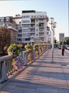 a sidewalk with a row of plants and a building at Issy Citea Access dayuse Room - Work and Day Rest Timeshare -- 2 min tram - Formule Temps Partagé -- Navette ile d'Issy Avenue Paris 92320 espace nuit in Issy-les-Moulineaux