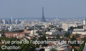 a view of a city with the eiffel tower at Issy Citea Access dayuse Room - Work and Day Rest Timeshare -- 2 min tram - Formule Temps Partagé -- Navette ile d'Issy Avenue Paris 92320 espace nuit in Issy-les-Moulineaux