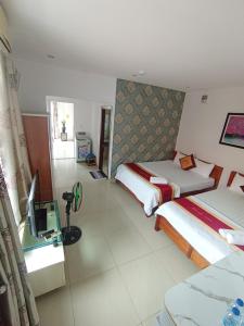 Postel nebo postele na pokoji v ubytování Đức Anh HoTel Vũng Tàu