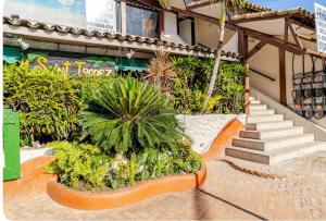 Taman di luar Loft dos anjos