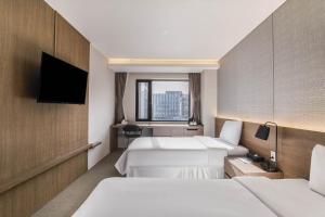 Hotel Elora客房内的一张或多张床位